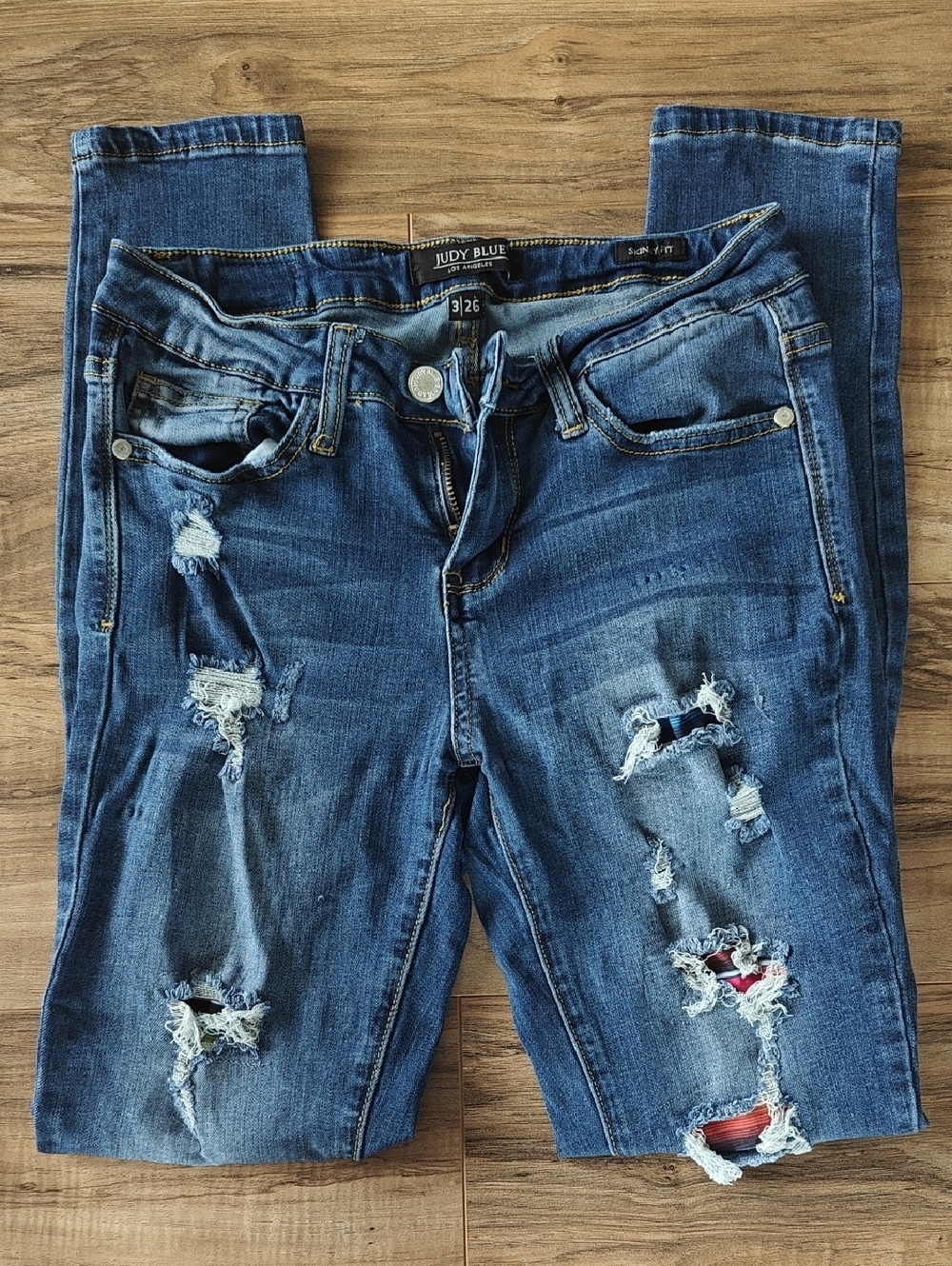EUC Serape Patch Distressed Skinny Jeans